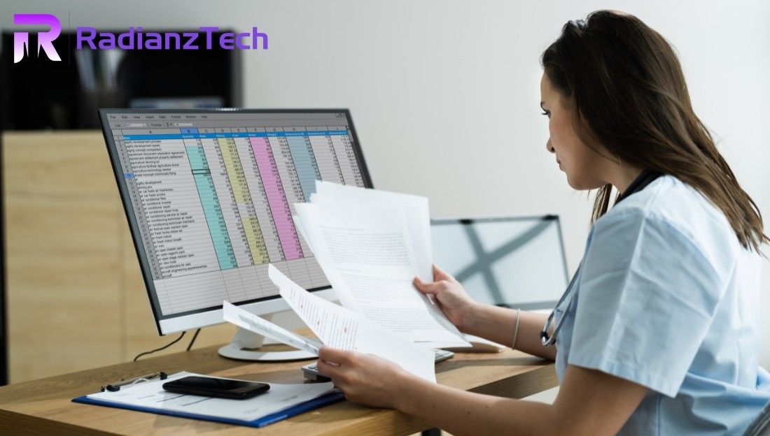 Medical professional reviewing patient records and spreadsheets related to Medical Billing Services.